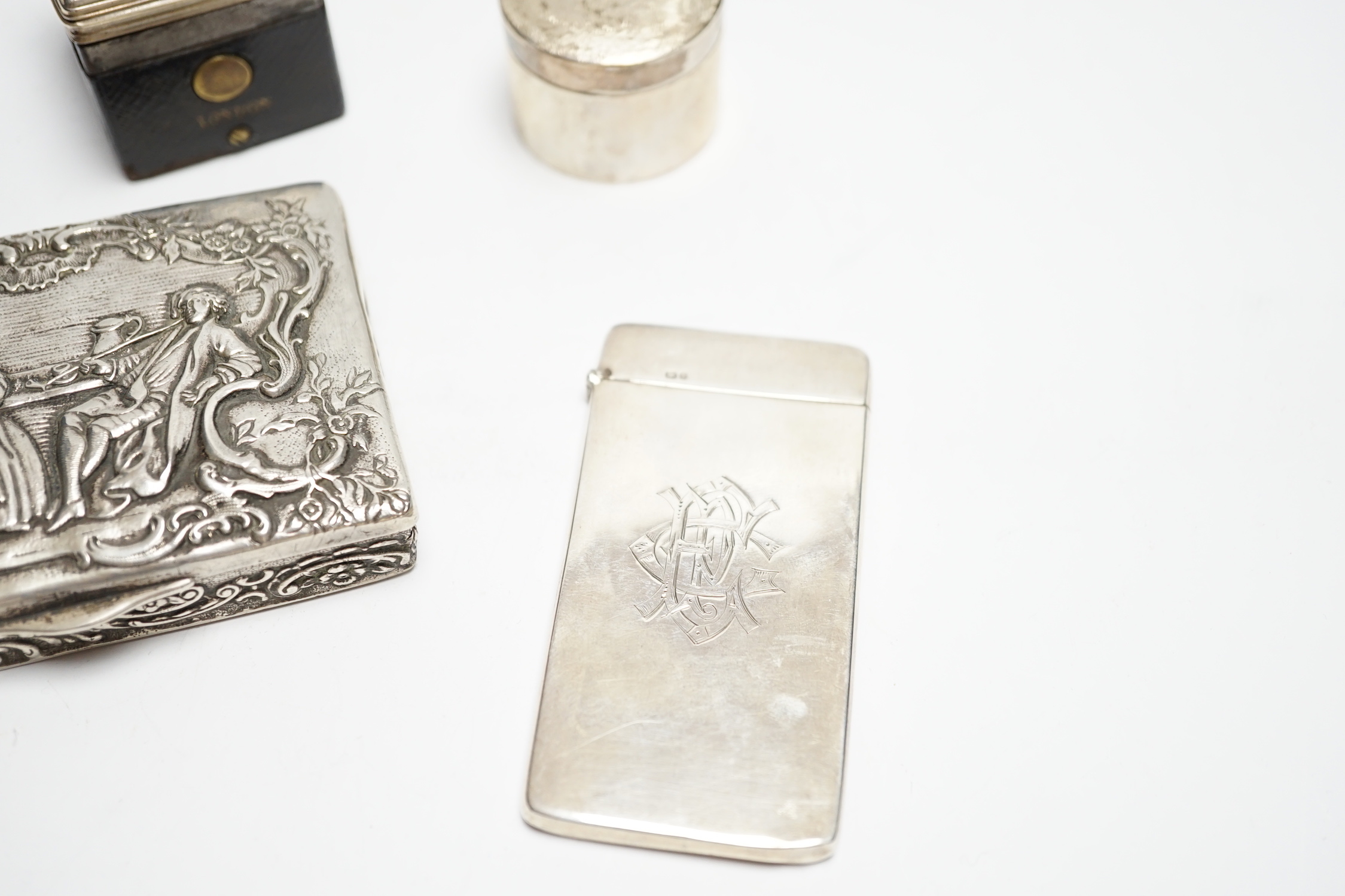 A German embossed 800 standard white metal snuff box, 87mm a silver card case, a modern silver drum shaped box(a.f.) and a silver mounted inkwell .